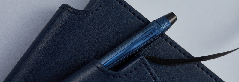Brushed Dark Blue PVD Tech3+ Pen placed in the pen slot of a Midnight Blue journal.