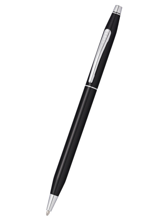 A slim bodied Cross ballpoint pen with black lacquer and precious metal details.